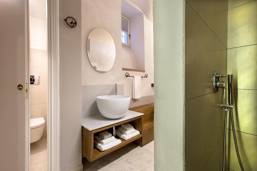 a bathroom with a sink and a mirror at Dimora del Leone Gaeta in Gaeta