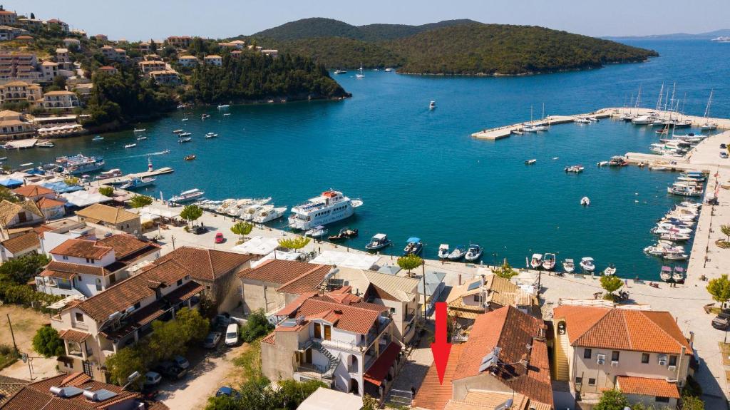 an aerial view of a harbor with boats in the water at Τrilogy Studios in Syvota