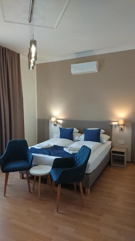 Postel nebo postele na pokoji v ubytování Hotel Napsugár