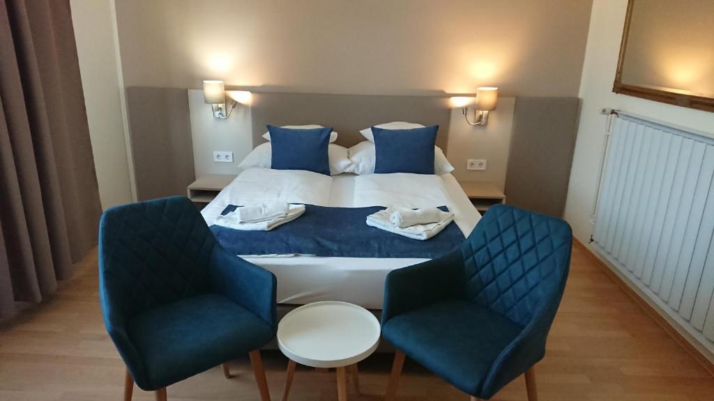 Postel nebo postele na pokoji v ubytování Hotel Napsugár