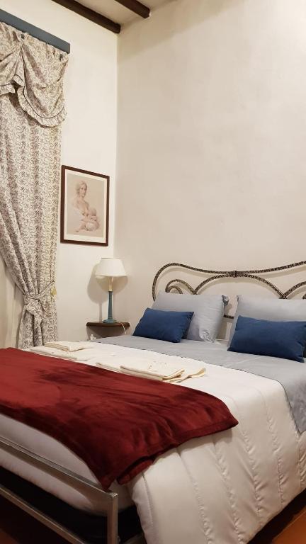 Posteľ alebo postele v izbe v ubytovaní Ginevra Casa Vacanze