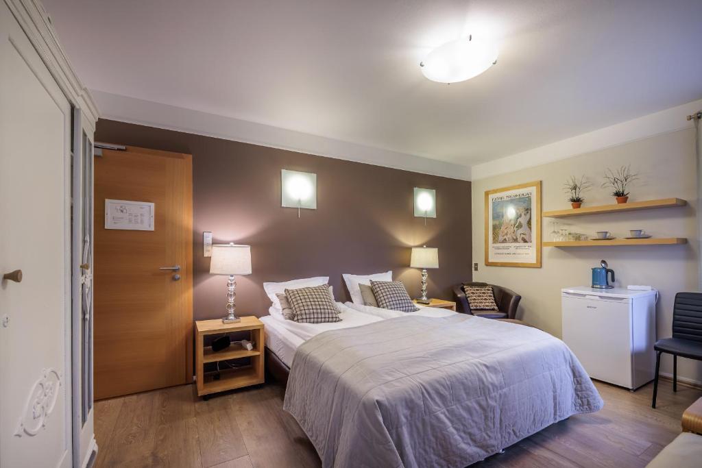 Postel nebo postele na pokoji v ubytování Snorri's Guesthouse