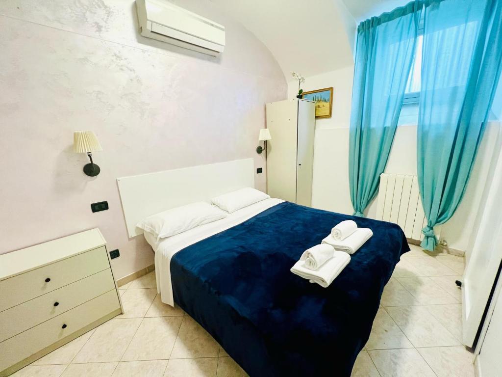 Postel nebo postele na pokoji v ubytování Hotel Pisa