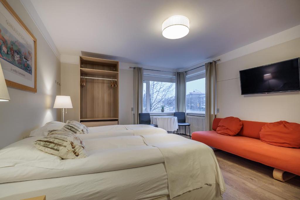 Postel nebo postele na pokoji v ubytování Snorri's Guesthouse