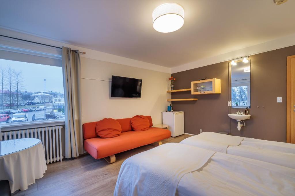 Postel nebo postele na pokoji v ubytování Snorri's Guesthouse