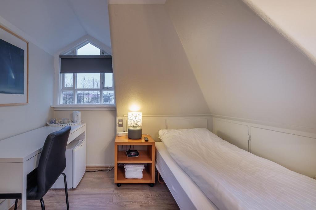 Postel nebo postele na pokoji v ubytování Snorri's Guesthouse