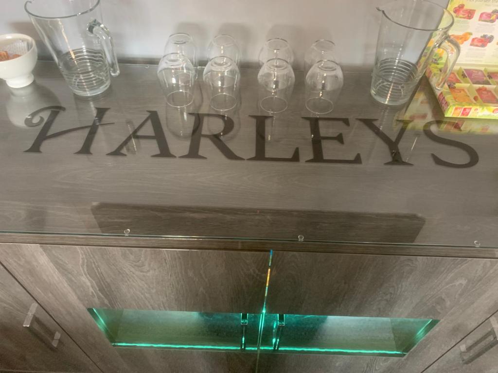 a glass table with a sign that says harley at Harleys Reads Avenue in Blackpool