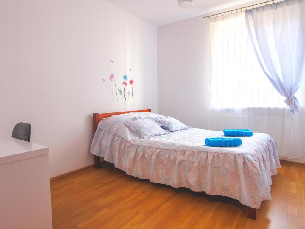 Posteľ alebo postele v izbe v ubytovaní Zachodnia Apartamenty LUNA Białystok