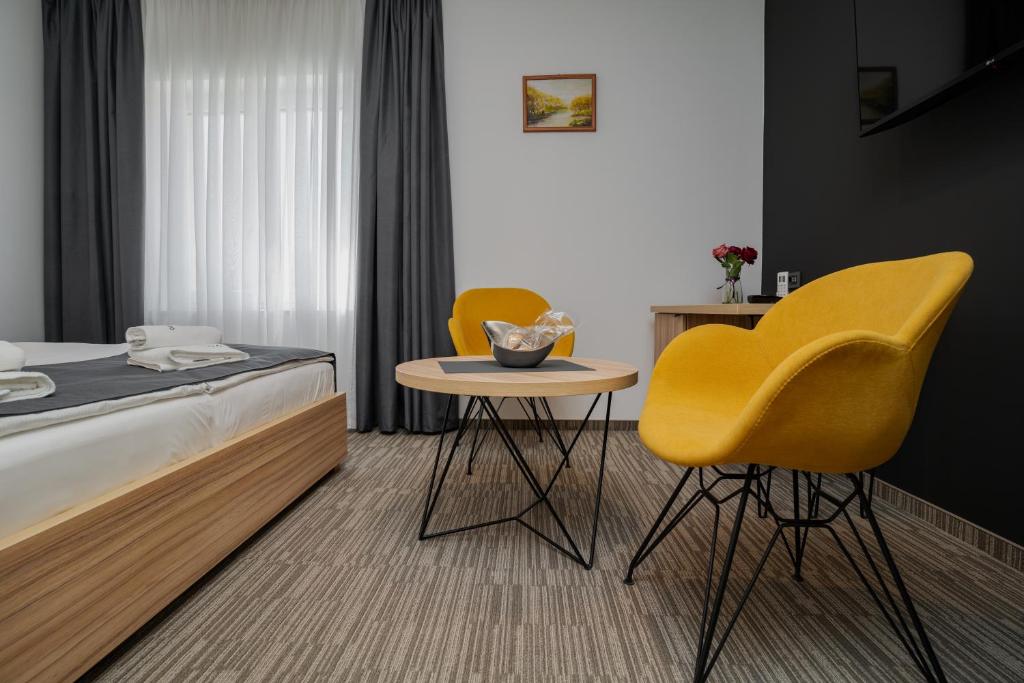 Postel nebo postele na pokoji v ubytování Maestro - Rooms & Restaurant