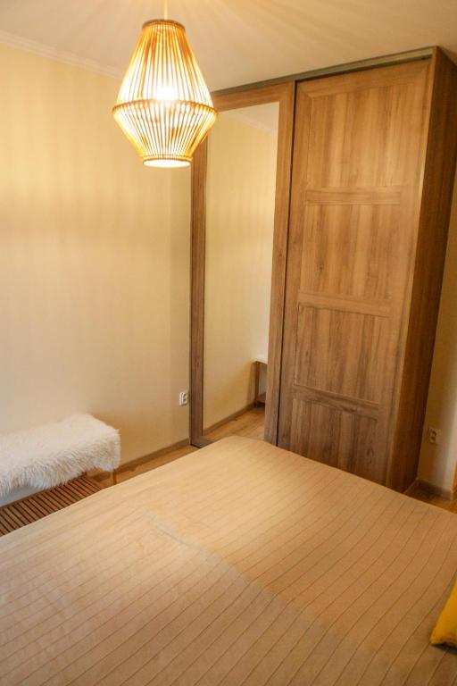 Postel nebo postele na pokoji v ubytování Rustique Šamorín