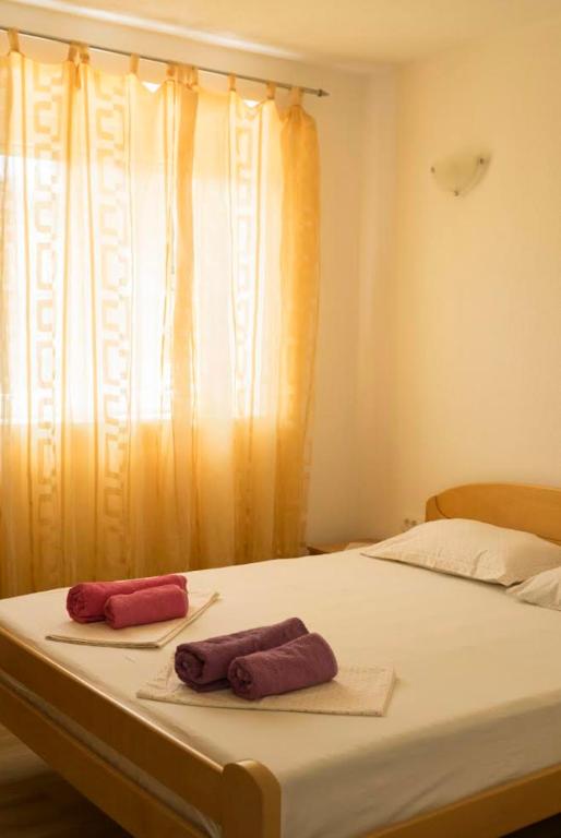 Postel nebo postele na pokoji v ubytování Franovic Apartments