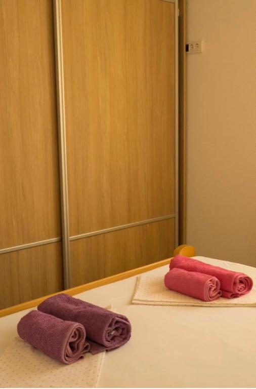 Postel nebo postele na pokoji v ubytování Franovic Apartments