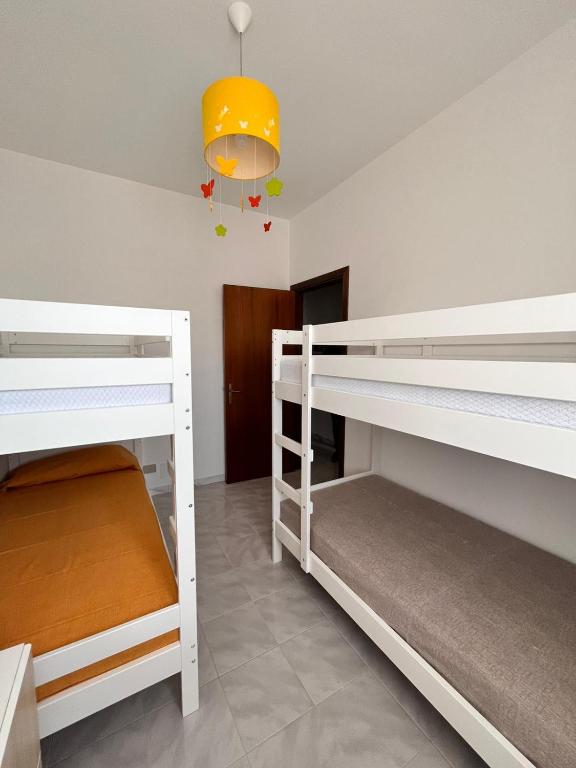 Postel nebo postele na pokoji v ubytování suli e mari