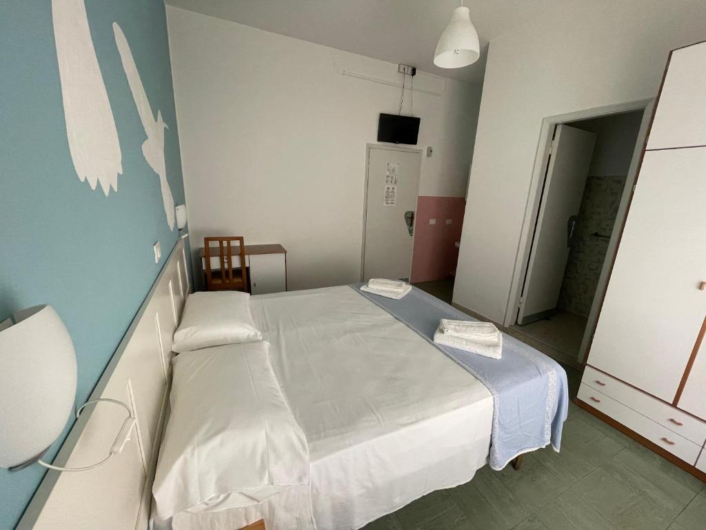 Postel nebo postele na pokoji v ubytování Hotel Aloha