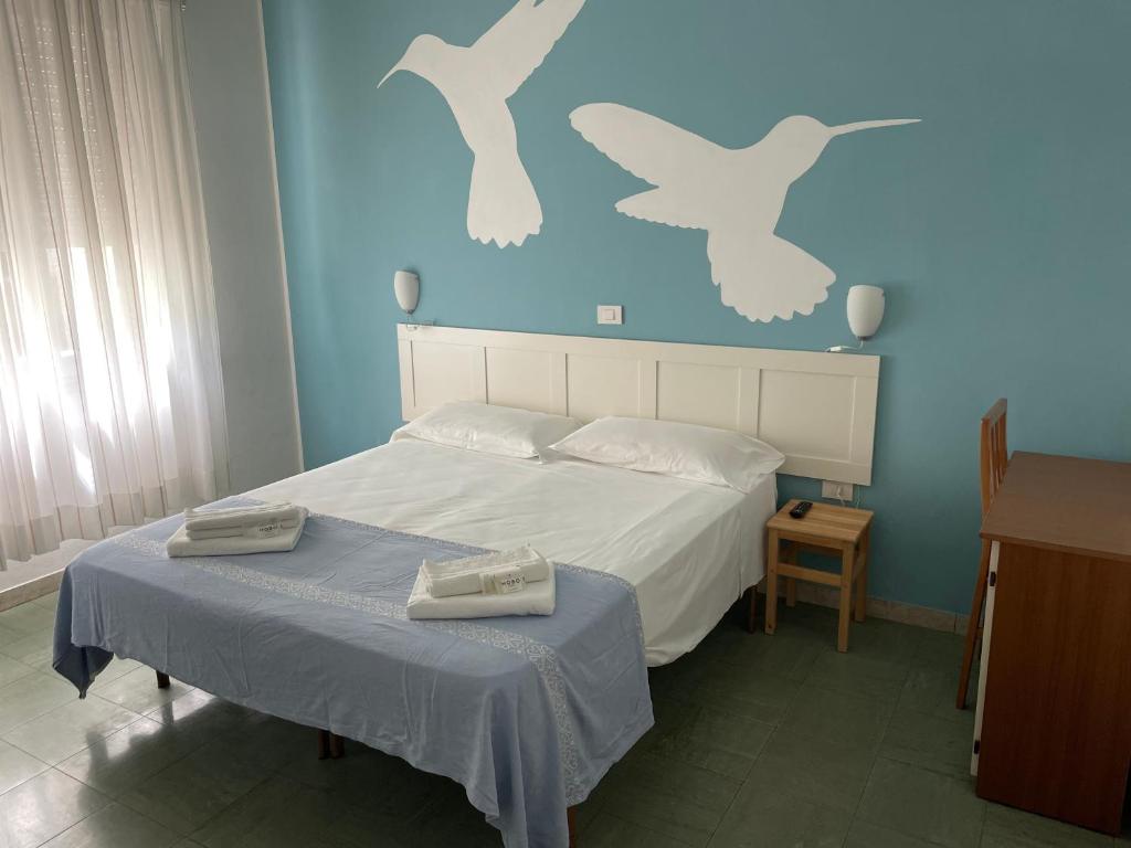 Postel nebo postele na pokoji v ubytování Hotel Aloha