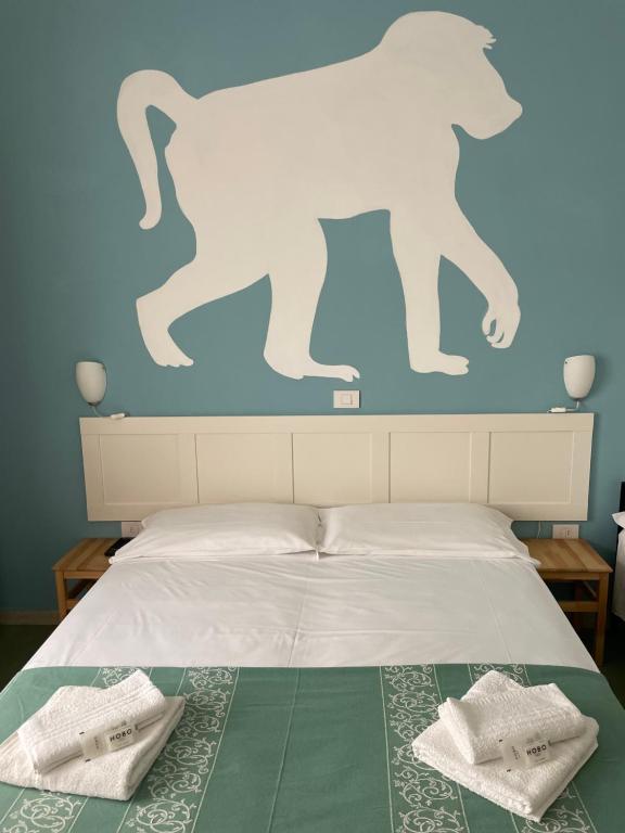 Postel nebo postele na pokoji v ubytování Hotel Aloha
