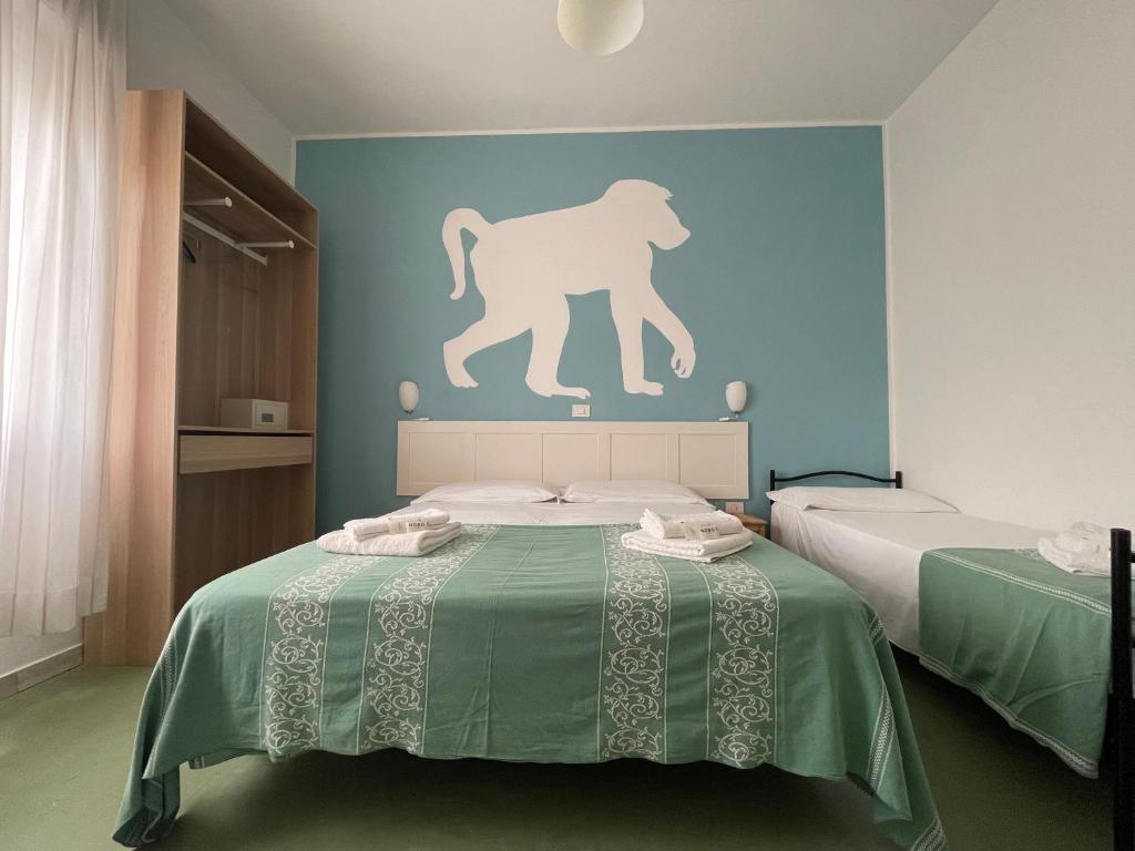 Postel nebo postele na pokoji v ubytování Hotel Aloha