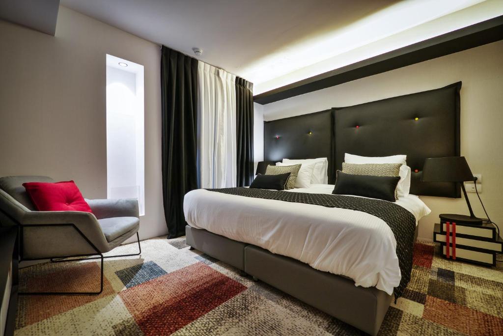 Postel nebo postele na pokoji v ubytování 21st Floor Hotel