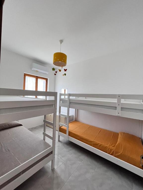 Postel nebo postele na pokoji v ubytování suli e mari