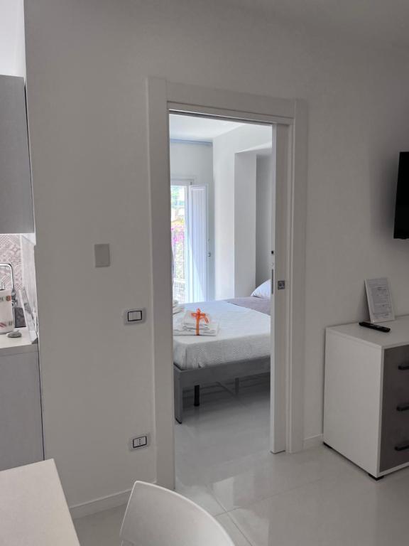 Postel nebo postele na pokoji v ubytování Aretusa Resort Amalfi Coast