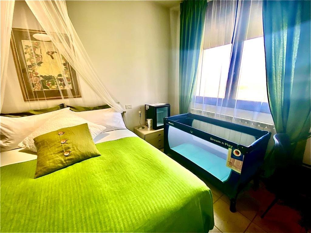 A bed or beds in a room at GARDEN OF VENICE