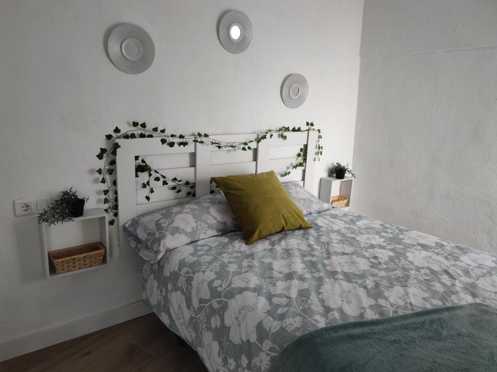 Łóżko lub łóżka w pokoju w obiekcie Encantadora Casa con Patio