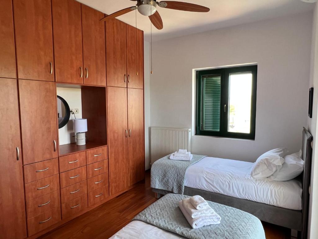 Ένα ή περισσότερα κρεβάτια σε δωμάτιο στο Paradisos Villa - Chania, Crete