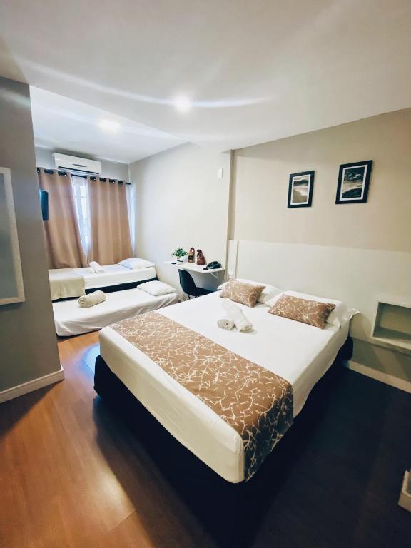 Postel nebo postele na pokoji v ubytování Hotel Lorimar