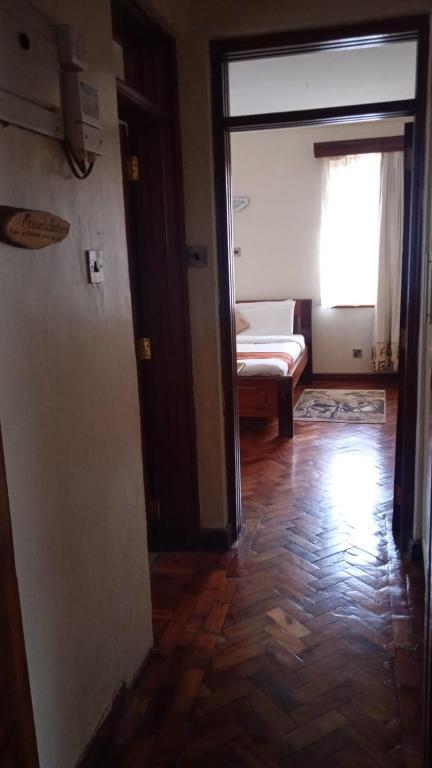 Postel nebo postele na pokoji v ubytování dreamplace Gigiri