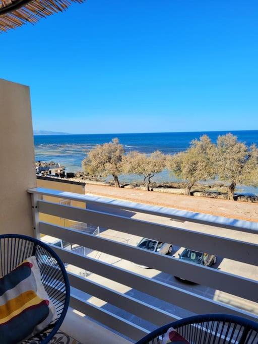 a balcony with a view of the beach and the ocean at Casa del Borgo in Marzamemi