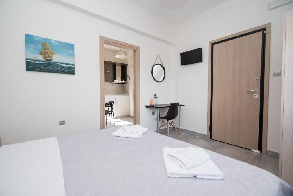 Posteľ alebo postele v izbe v ubytovaní Andromeda's Apartments
