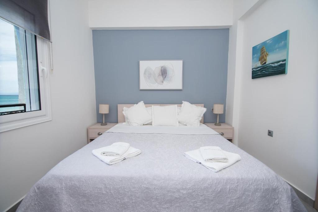 Posteľ alebo postele v izbe v ubytovaní Andromeda's Apartments