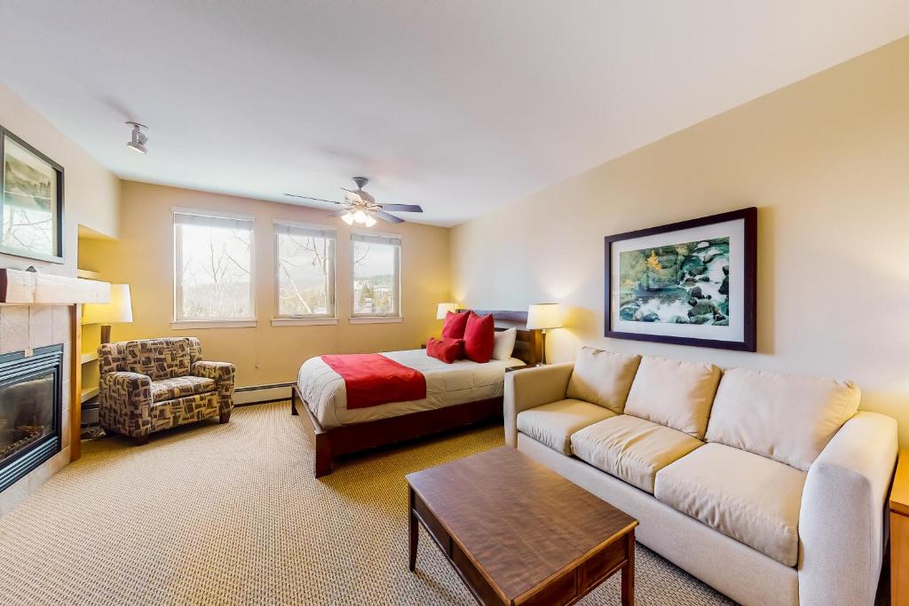 a living room with a couch and a bed at Fraser Crossing 3404 in Winter Park