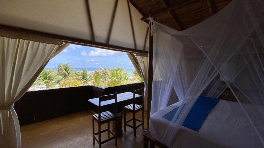 Postel nebo postele na pokoji v ubytování Eco Cabañas Bluekay