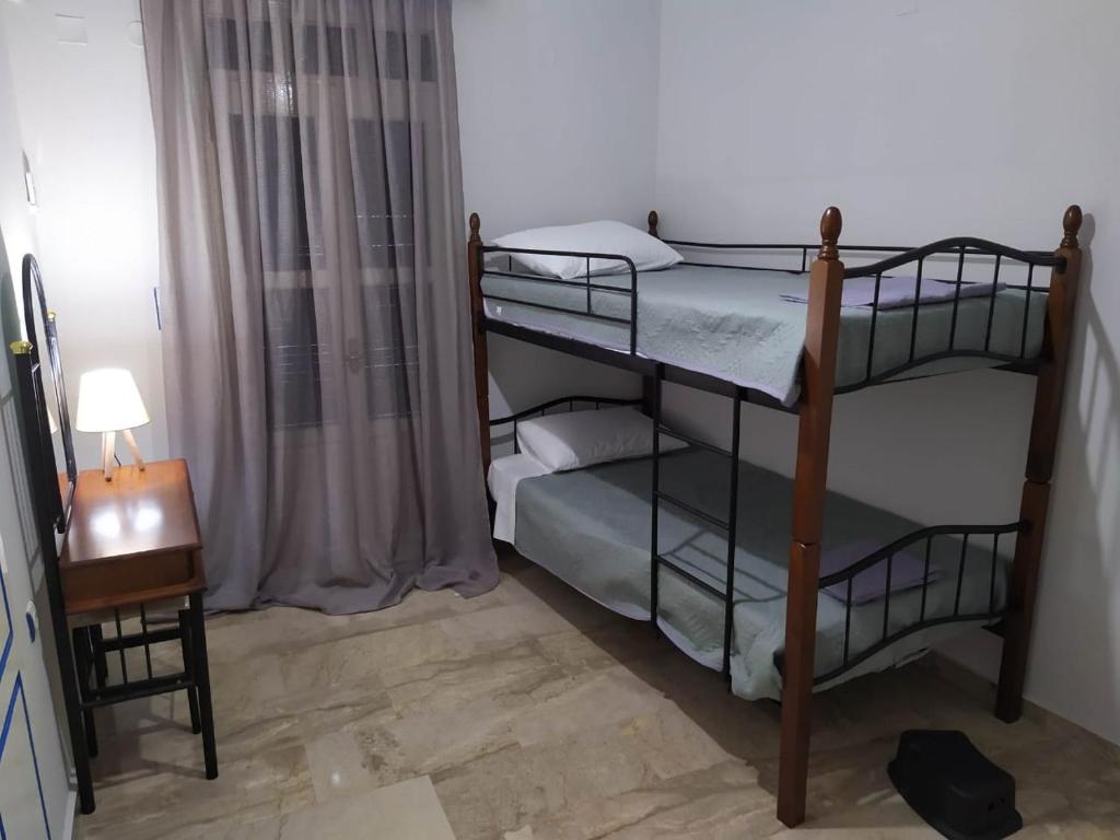 Postel nebo postele na pokoji v ubytování Kisiris House