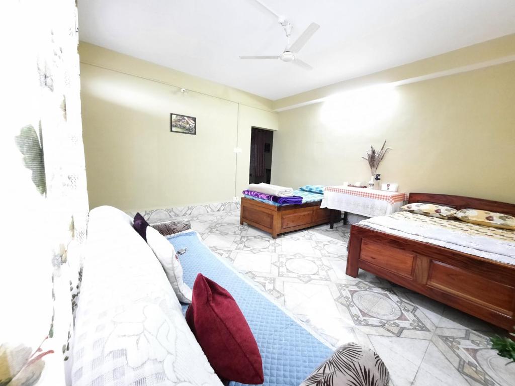 Postel nebo postele na pokoji v ubytování Kalimpong Sunrise-Inn Homestay