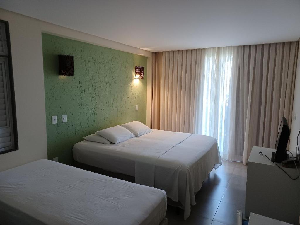 Postel nebo postele na pokoji v ubytování Pousada Laguna