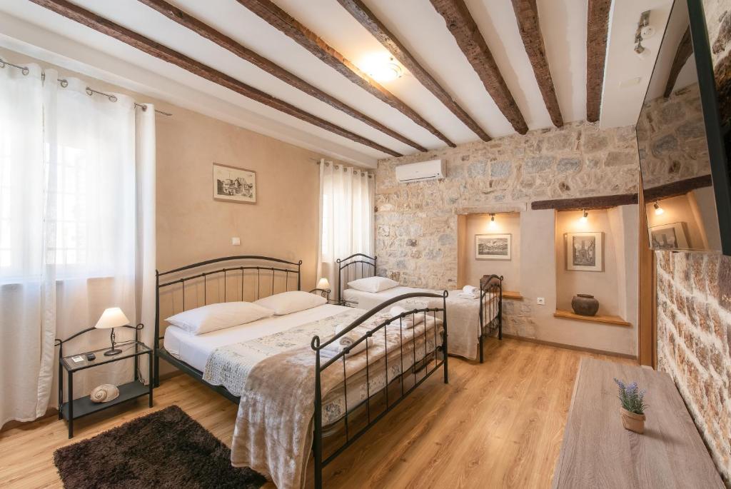 Säng eller sängar i ett rum på Dolce Vita Apartments