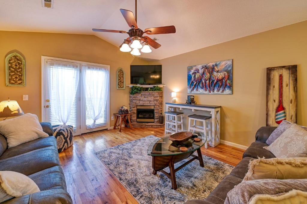 a living room with a couch and a fireplace at High N Dry-Quiet River Access Neighborhood, 1 Mile to Parkway, 5 Miles to Dollywood! in Pigeon Forge