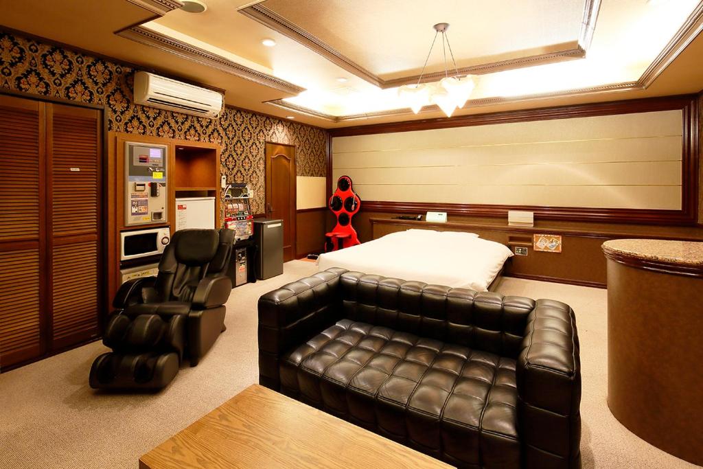 Postel nebo postele na pokoji v ubytování 隠家(ajito) HOTEL555 御殿場2