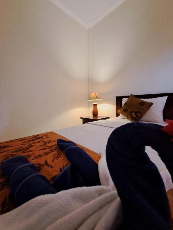Postel nebo postele na pokoji v ubytování Home Stay Evo