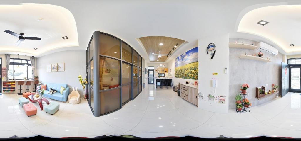 a large room with a lobby with a large glass door at Beauty Chen's House #3 in Tianwei