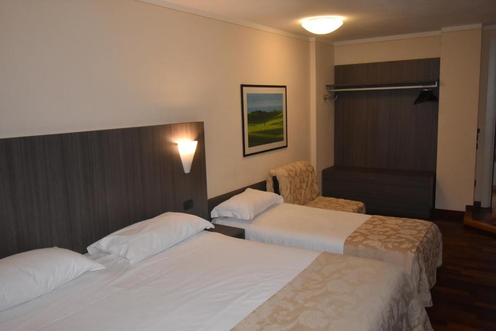 Postel nebo postele na pokoji v ubytování Hotel Boutique Antiche Mura