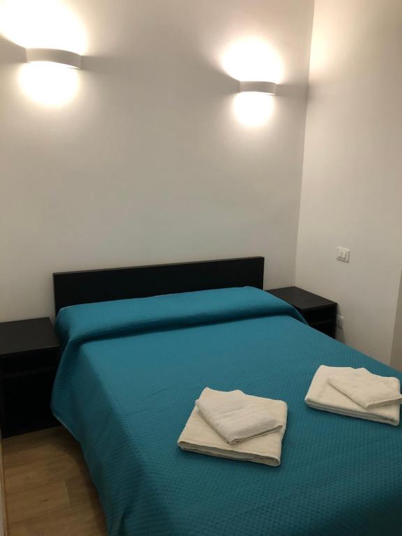 Postel nebo postele na pokoji v ubytování Harmony Affittacamere