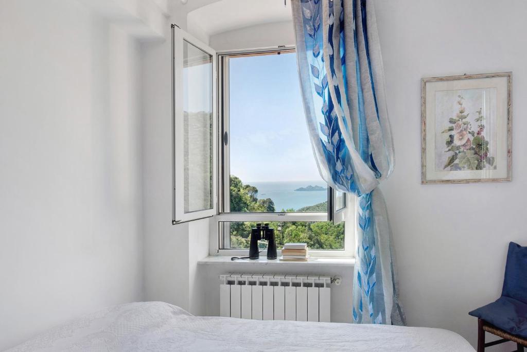 Postel nebo postele na pokoji v ubytování Cottage con vista mare