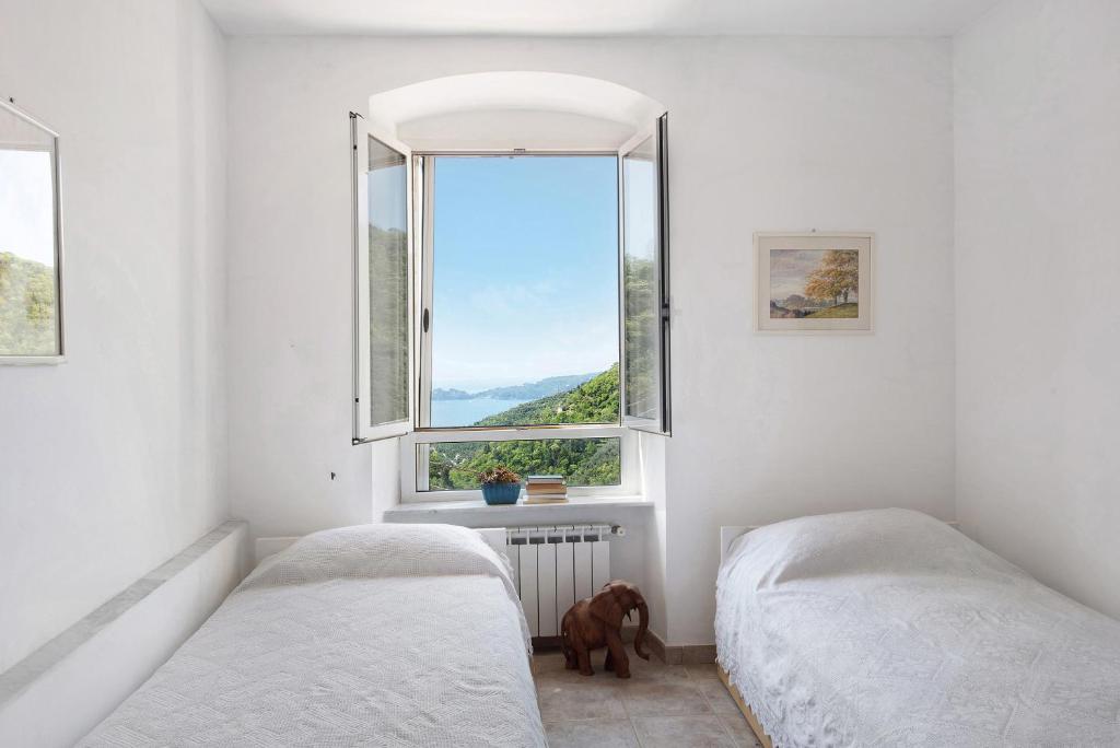 Postel nebo postele na pokoji v ubytování Cottage con vista mare