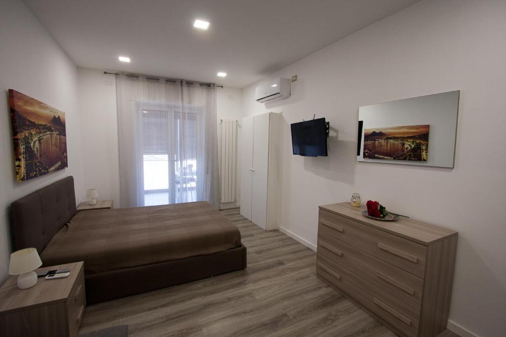 Posteľ alebo postele v izbe v ubytovaní Casa Vacanze Mareluna