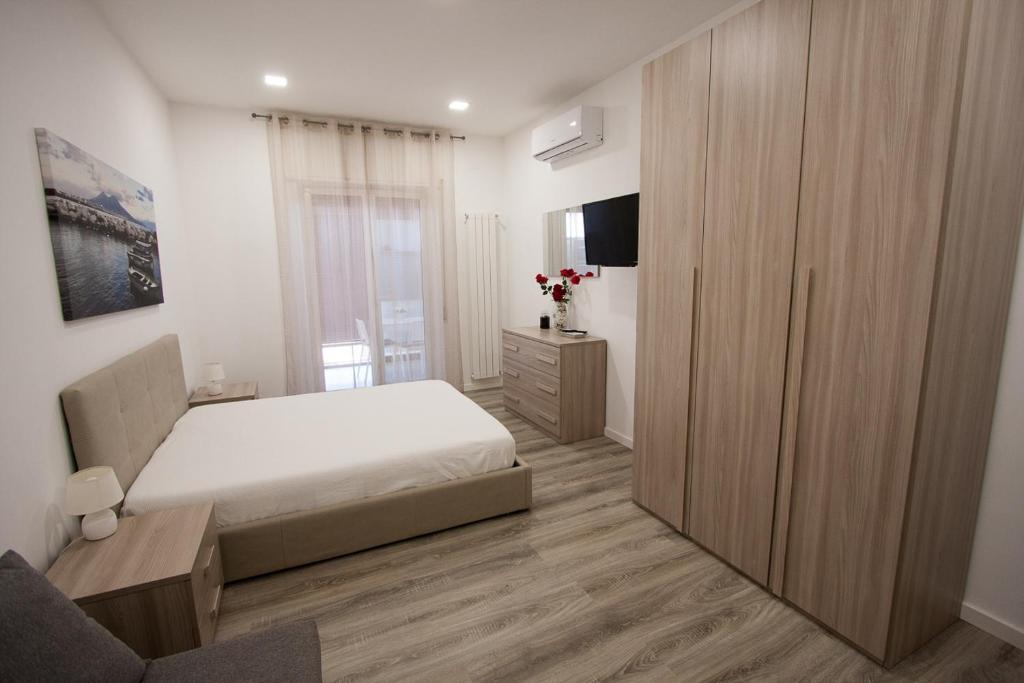 Posteľ alebo postele v izbe v ubytovaní Casa Vacanze Mareluna