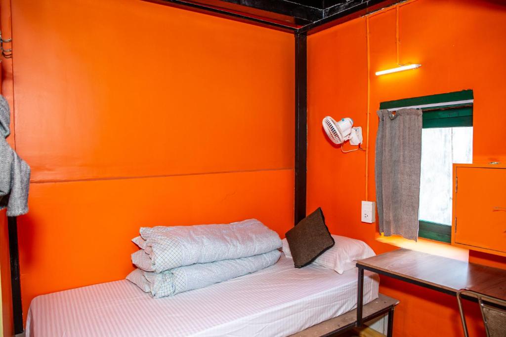 Postel nebo postele na pokoji v ubytování Trekkers Hostel