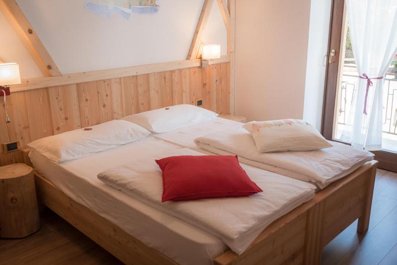 Postel nebo postele na pokoji v ubytování Garni Le Prealpi